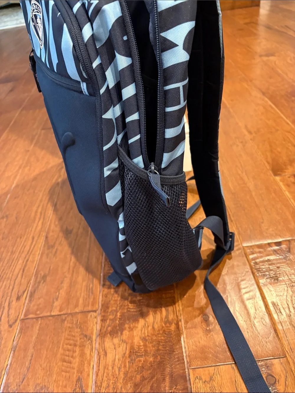 Puma Manchester City Black and Light Blue Striped Logo Backpack
